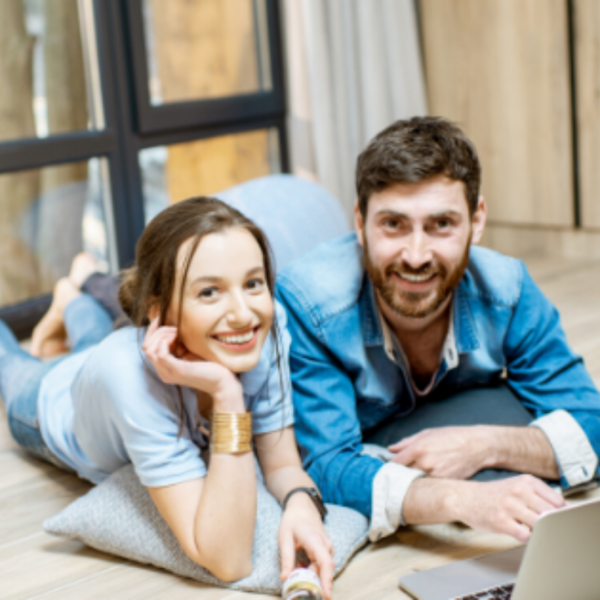 happy-man-and-woman-in-front-of-computer